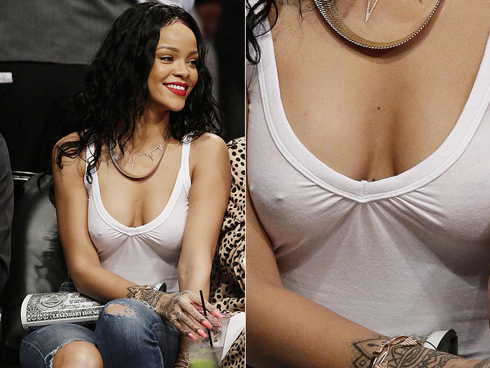 Rihanna deixa piercing no seio à mostra durante jogo de basquete