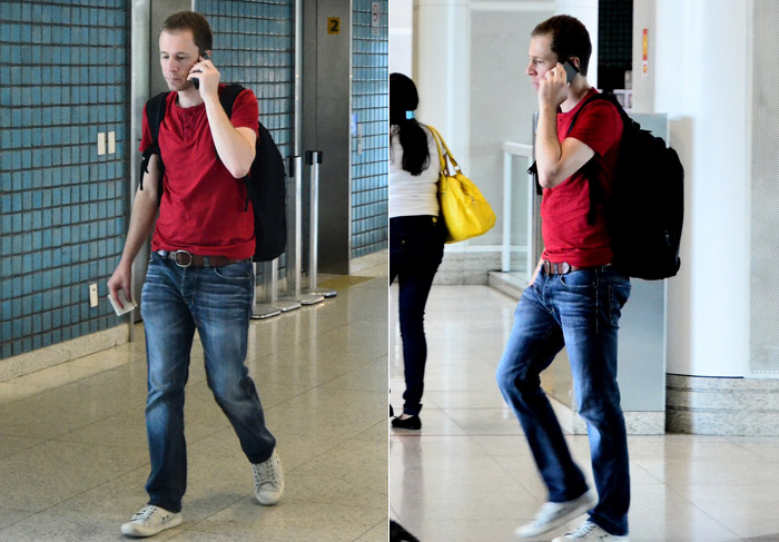 Simpático, Tiago Leifert acena para paparazzo ao embarcar em aeroporto
