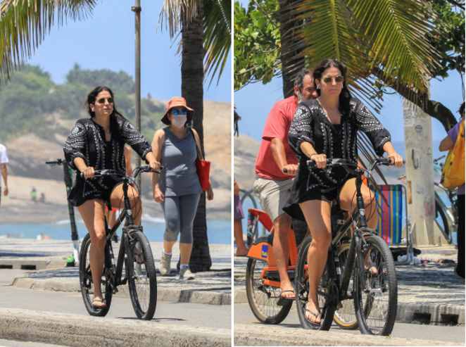 Malu Mader é clicada deixando a praia com uma bicicleta