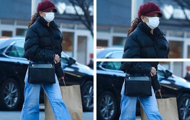 Katie Holmes passeia por Nova York usando vermelho e calça boca de sino 