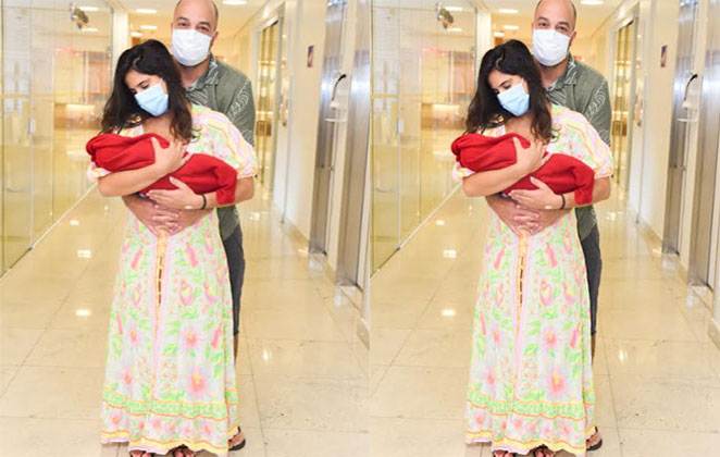 Casal esbanjou felicidade com a filha Julia na saída da maternidade