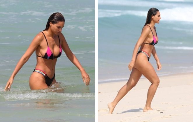 Débora Nascimento ainda desfilou suas curvas em um lindo biquíni preto com detalhes coloridos