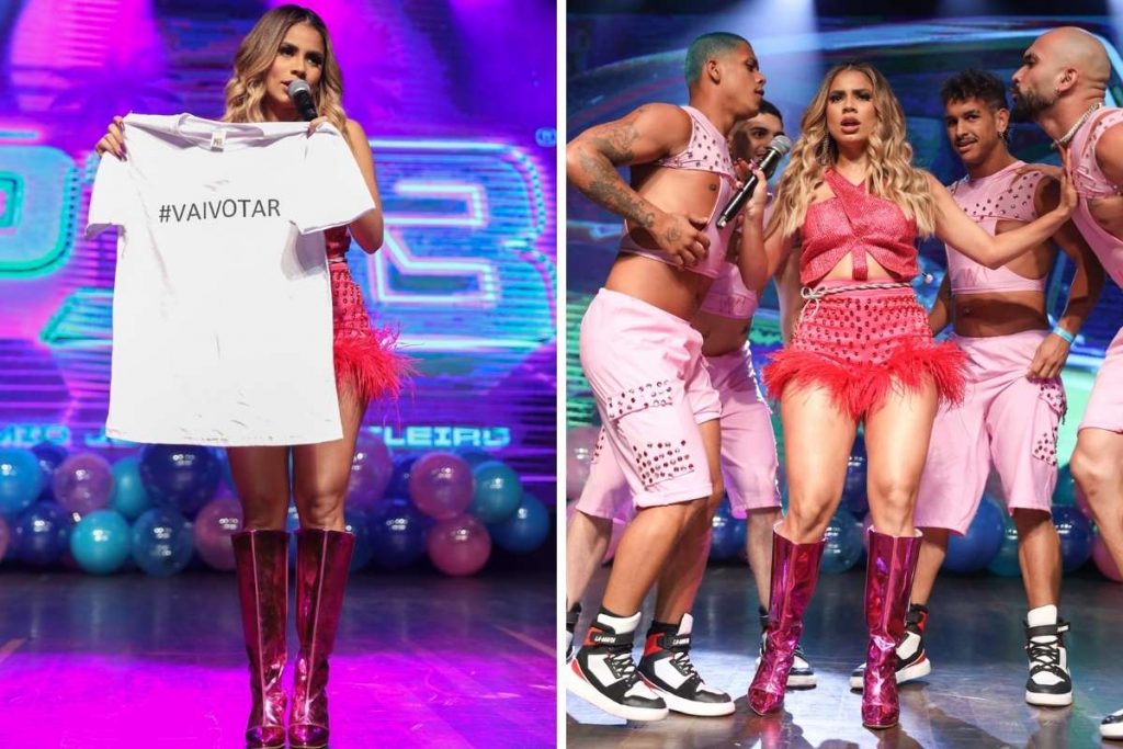 Cantora levantou a camiseta estampada #VAIVOTAR durante show.