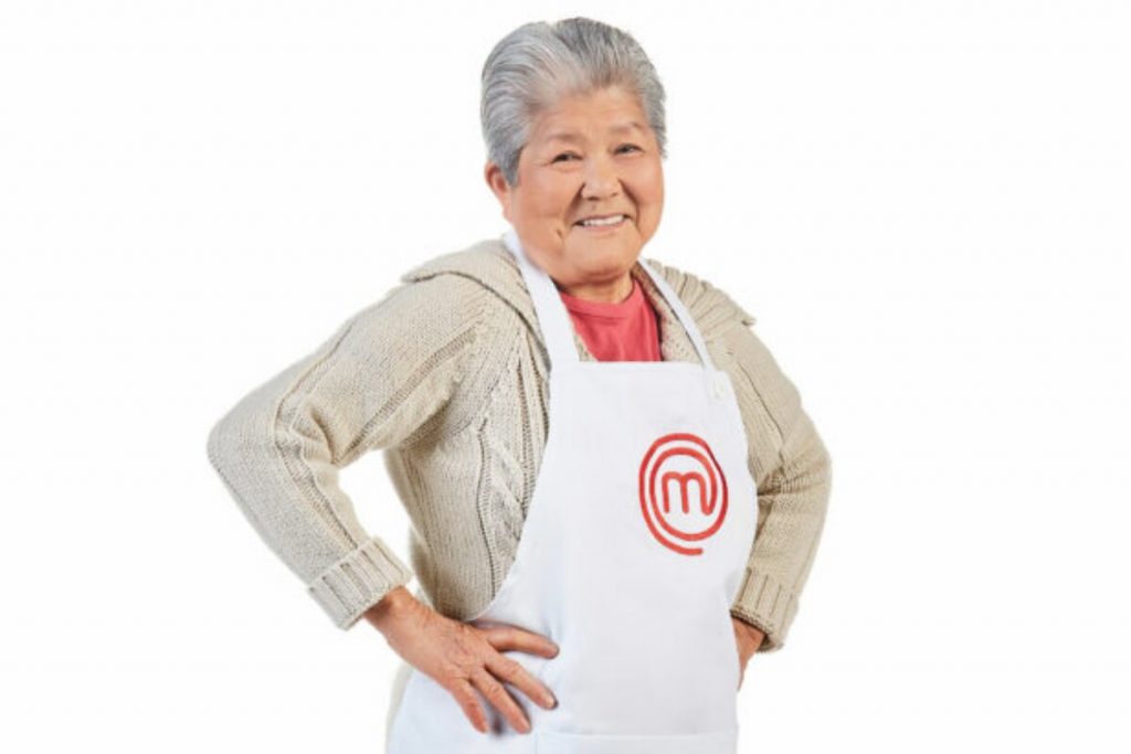 Participante Masterchef + com avental do programa