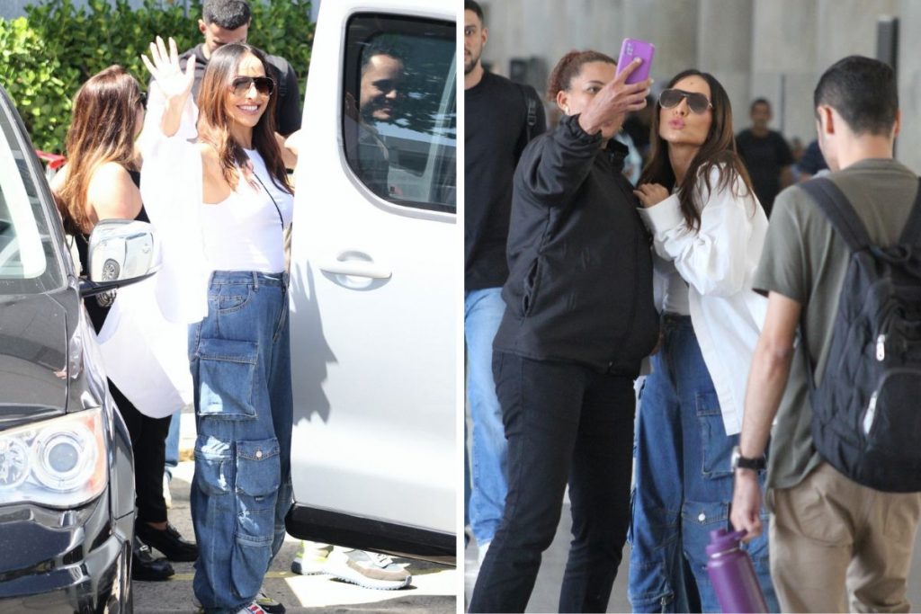 Sabrina Sato acena para os fotógrafos em aeroporto no Rio de Janeiro