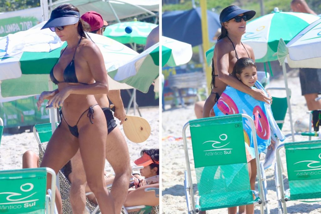 Deborah Secco com a família na praia da Barra da Tijuca e mostrando a boa forma