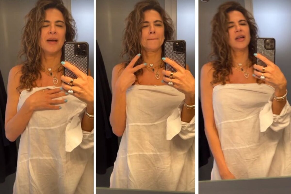 Luciana Gimenez de toalha fazendo selfie no espelho