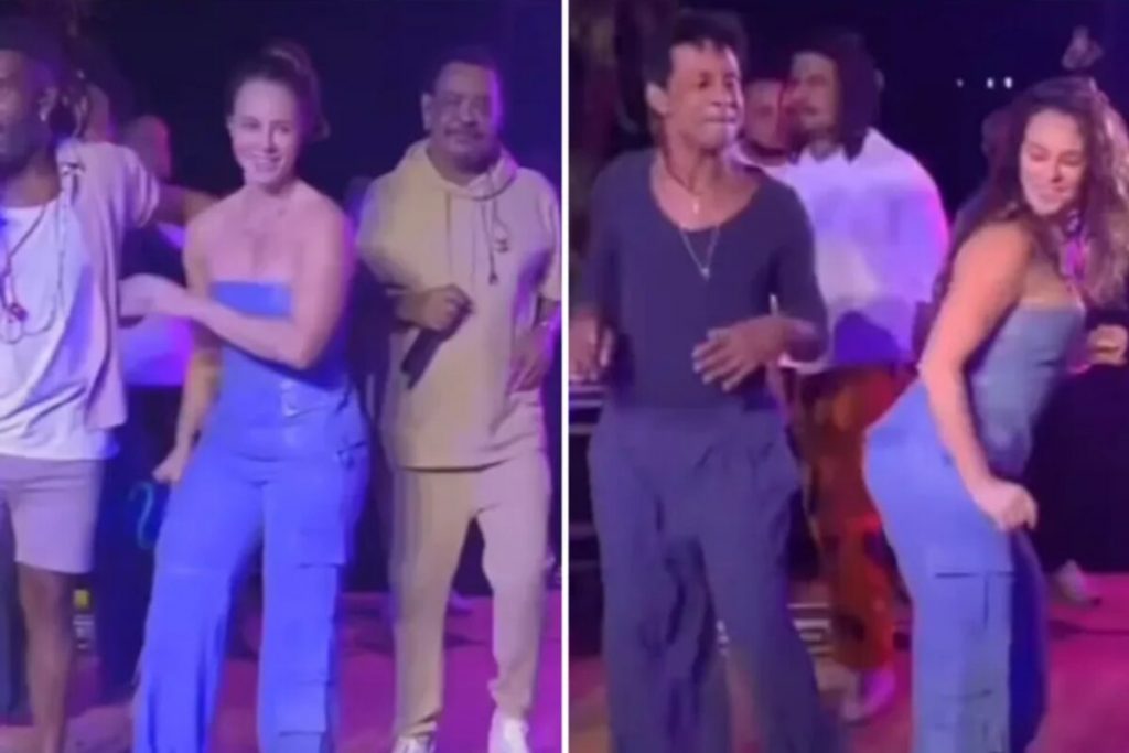 Paolla Oliveira de macacão tomara-que-caia azul dançando com Compadre Washington e Luis Miranda 